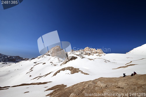 Image of Two hikers on halt in snowy mountain