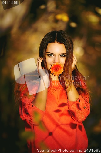 Image of Girl with a flower in his mouth