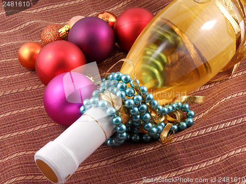 Image of Champagne bottle with Christmas balls and diamonds