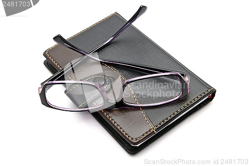 Image of notebook and glasses 