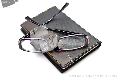 Image of notebook and glasses 