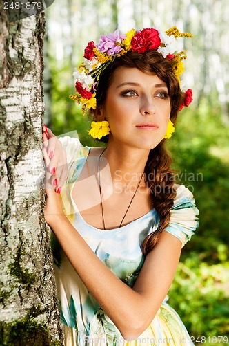 Image of Attractive woman with flower wreath