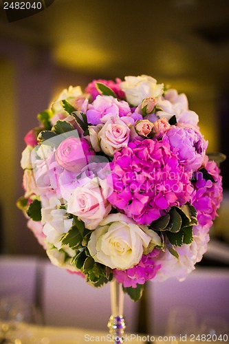 Image of Celebratory tables decorated with flowers