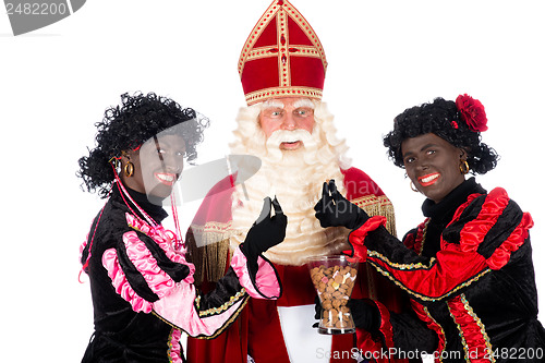 Image of Zwarte Piet giving pepernoten (cookies) to Sinterklaas