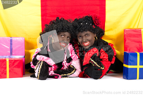 Image of Two Zwarte Pieten lying