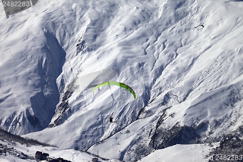 Image of Speed flying in winter mountains