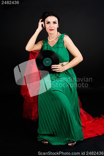 Image of Pretty girl holding vinyl disc