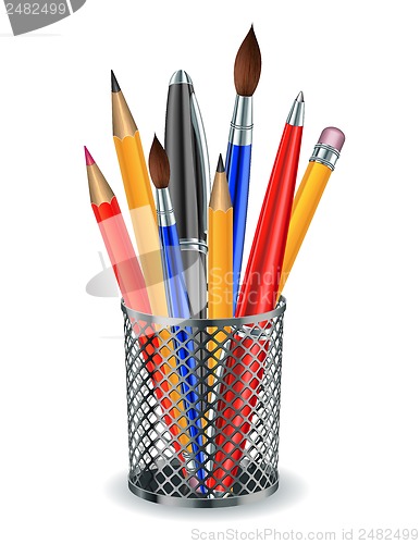 Image of Brushes, pencils and pens in the holder.