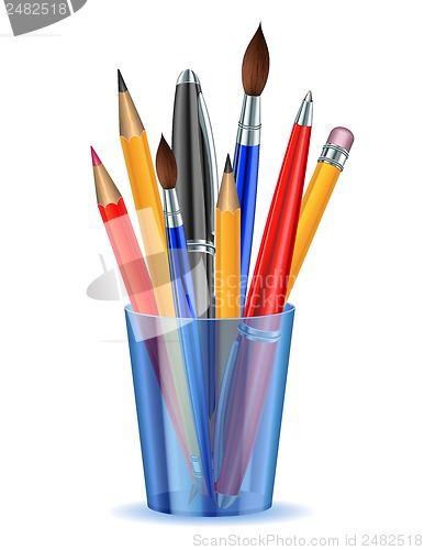 Image of Brushes, pencils and pens in the holder.