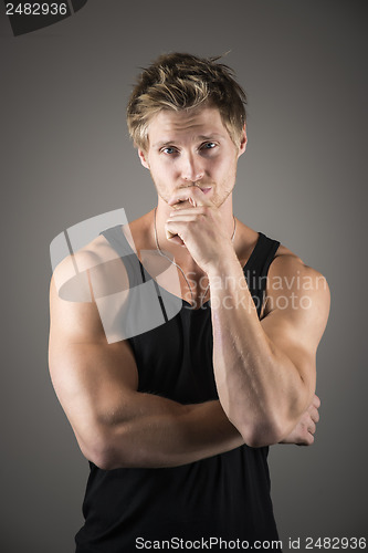 Image of Blond handsome man in black shirt