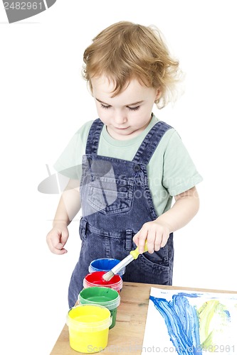 Image of child with brush and paint in white background