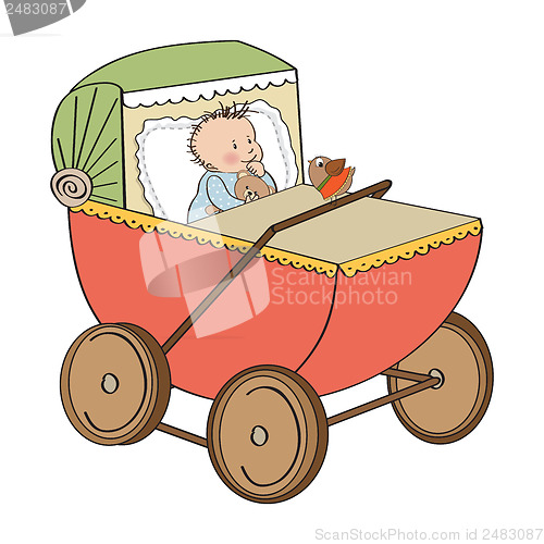 Image of baby boy in retro stroller isolated on white background