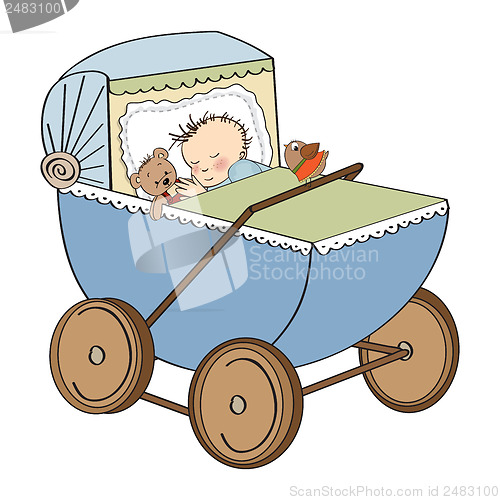 Image of baby boy in retro stroller isolated on white background