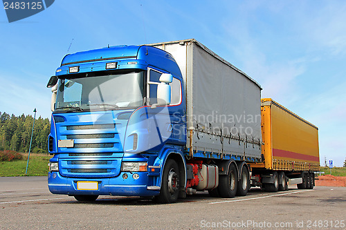 Image of Blue Truck with Semi Trailer