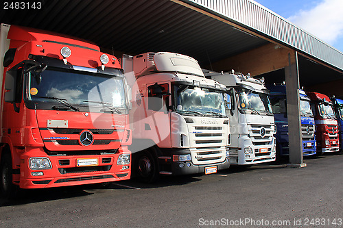 Image of Mercedes-Benz and Scania Trucks in a Carport