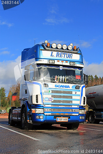 Image of Sunlight on Blue and White Scania Truck in Autumn