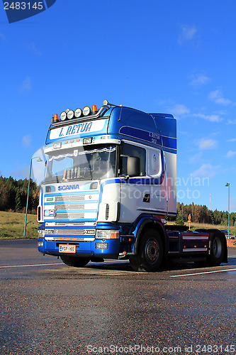 Image of Sunlight on Blue and White Scania L164 Truck in Autumn