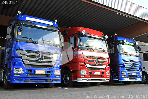Image of Row of Mercedes-Benz Actros Trucks in Carport