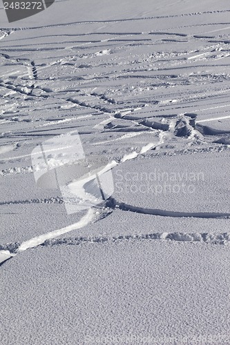 Image of Traces of skis and snowboards in new-fallen snow