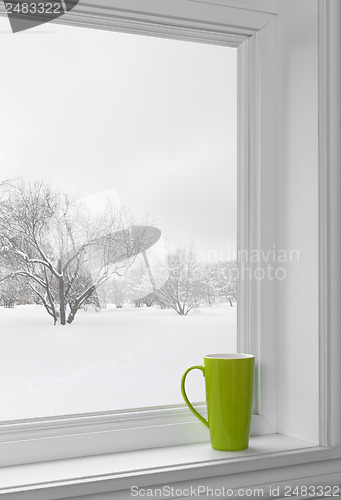 Image of Green cup on a windowsill