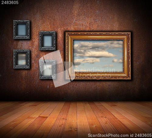 Image of architectural backdrop with frames on grunge wall