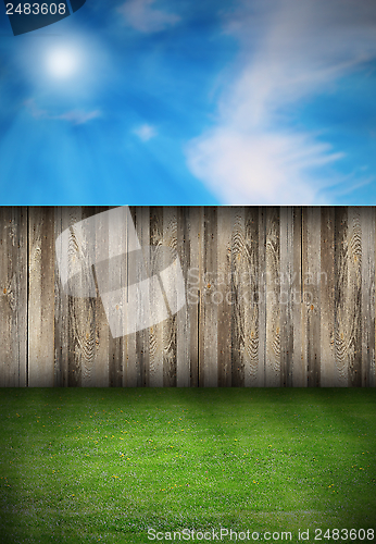 Image of backyard with fence and green turf