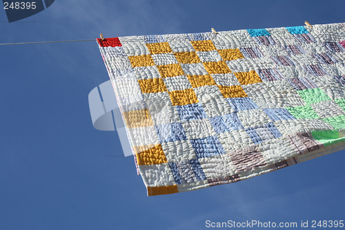 Image of Laundry - bright counterpane hanging to dry