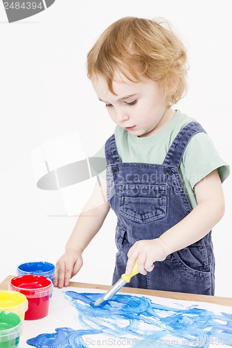 Image of cute child making picture