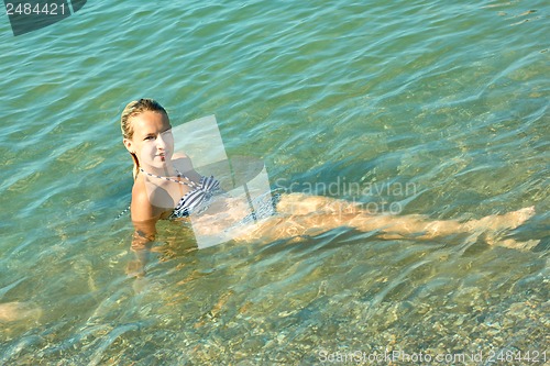 Image of Teen girl on the coastal seawater