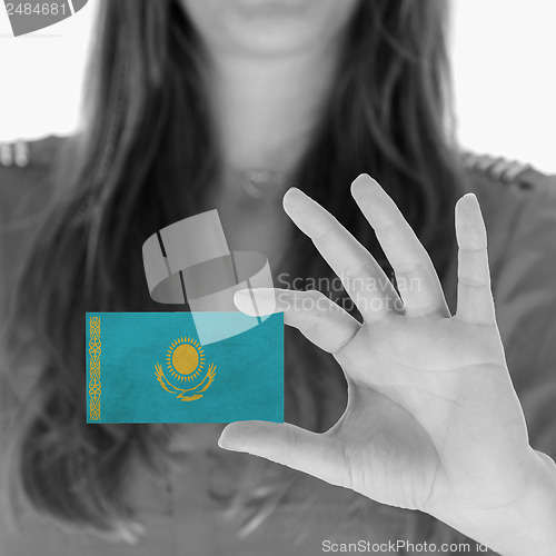 Image of Woman showing a business card