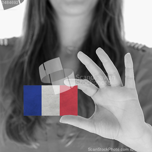 Image of Woman showing a business card