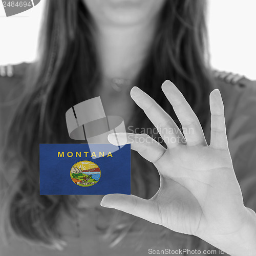 Image of Woman showing a business card