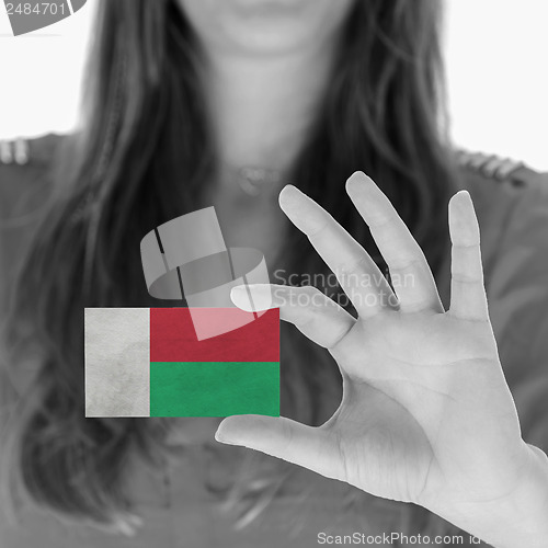 Image of Woman showing a business card