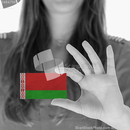 Image of Woman showing a business card