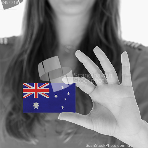 Image of Woman showing a business card