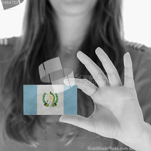 Image of Woman showing a business card