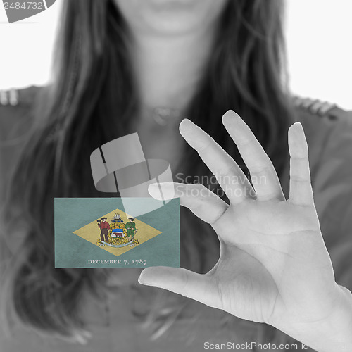 Image of Woman showing a business card