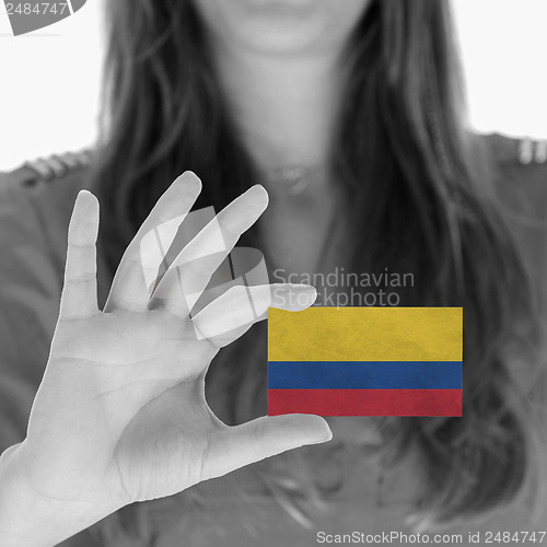 Image of Woman showing a business card
