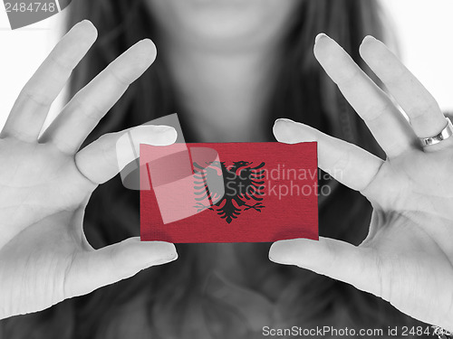 Image of Woman showing a business card