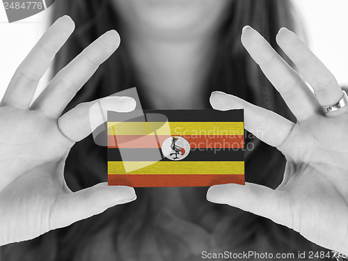 Image of Woman showing a business card