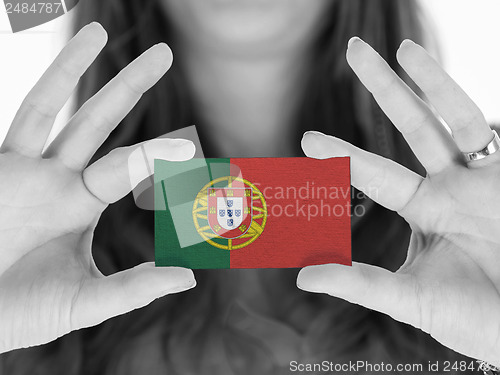 Image of Woman showing a business card