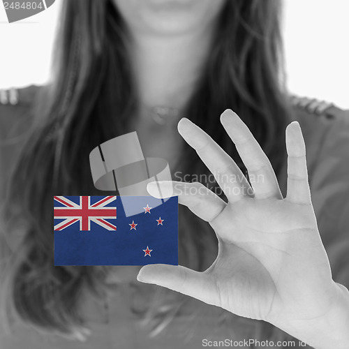 Image of Woman showing a business card