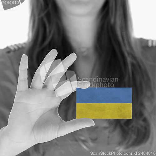 Image of Woman showing a business card