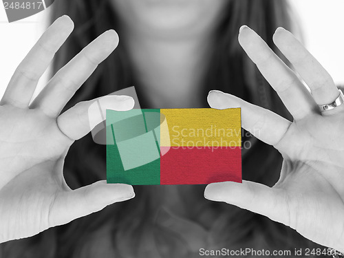 Image of Woman showing a business card