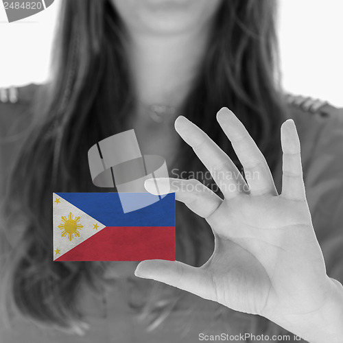 Image of Woman showing a business card