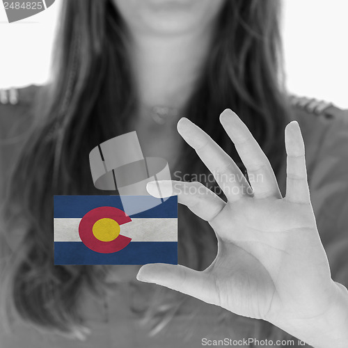 Image of Woman showing a business card