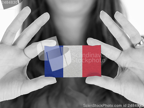 Image of Woman showing a business card