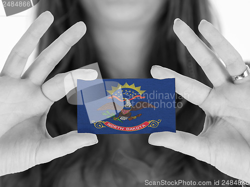 Image of Woman showing a business card