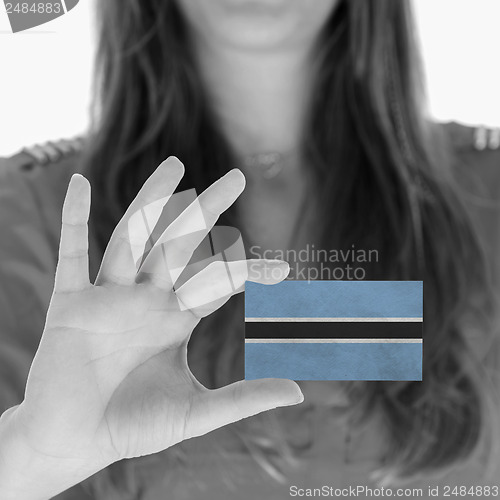 Image of Woman showing a business card