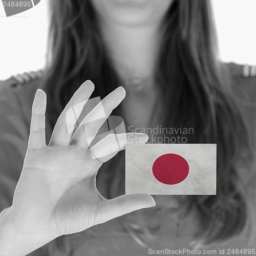 Image of Woman showing a business card